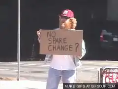 Homeless man flips sign to I take PayPal