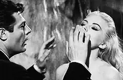 Man caresses woman's face