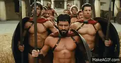 Spartans running through wheat field