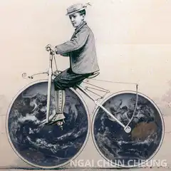 Boy riding bicycle with earth wheels
