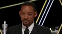 Will Smith looking down and smiling