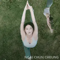 Woman doing yoga on grass