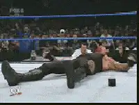 The Undertaker sits up and stares intensely