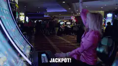 Woman celebrating jackpot win at slot machine