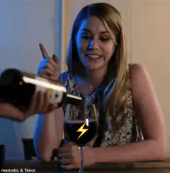 Woman pointing at wine glass with lightning bolt