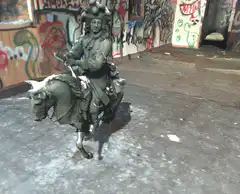 Green statue horseman spinning