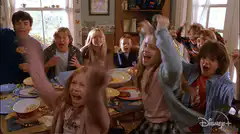 The Pickett kids cheer at the breakfast table