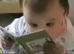 Baby reading a book
