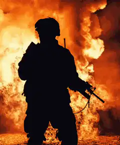 Soldier silhouette against fire