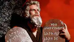 Moses holding stone tablets with fake text