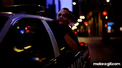 Officer relaxing in police car