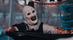 Bloody clown screaming in a car