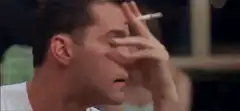 Ray Liotta smoking with intense stare