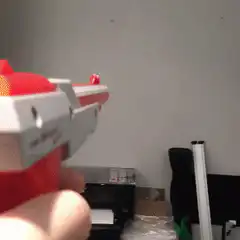 Toy gun shoots green laser