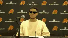 Devin Booker shrugs and smiles