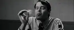 Bill Hader smoking and smiling