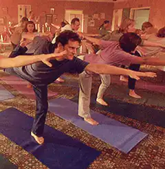 Man falls over in yoga class