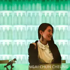 Woman smiling with squirrel on table