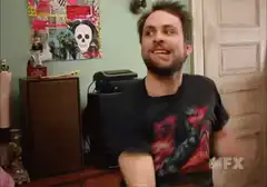 Charlie Day laughing and clapping