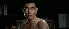 Tattooed man turns around