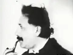 Albert Einstein smoking a pipe
