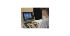 person typing on vintage computer