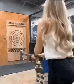 Woman throws axe and misses target