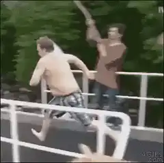 Man jumps off diving board into pool