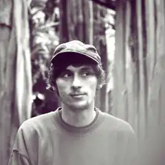 man in cap looking sideways
