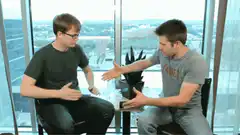 Two men doing a complex handshake