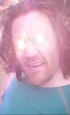 Man with glowing Bitcoin eyes