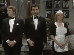 Mr. Bean bows to the Queen