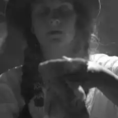 Woman smoking with eyes closed