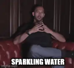 Man on couch says sparkling water