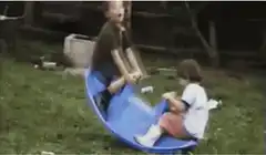 Kids on a blue seesaw