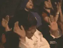 Woman praying with hands raised