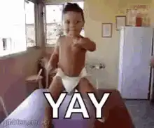 Baby dancing and pointing with YAY text