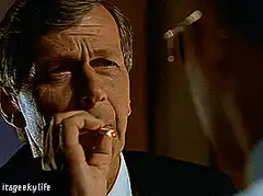 Man smoking cigarette and turning away