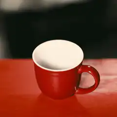 red mug filled with coffee