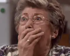 Older woman shocked and gasping