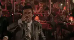 Joe Pesci drinks and laughs