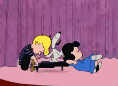 Snoopy dances while Lucy and Linus play piano
