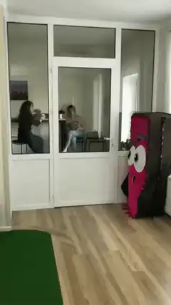 Woman startled by pink monster costume