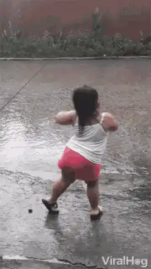 Toddler dancing in the rain