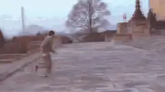 Man running then raising arms in triumph