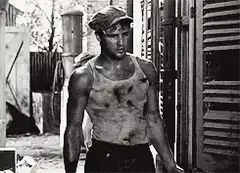 Marlon Brando walking with a beer