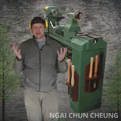 Man shrinks a green lathe machine