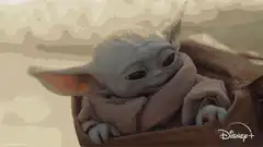 Baby Yoda looks around and smiles