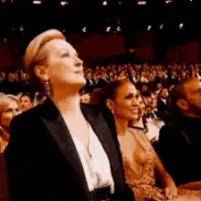 Meryl Streep excitedly points at the stage