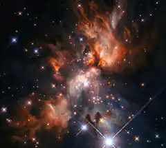 Colorful nebula with bright stars